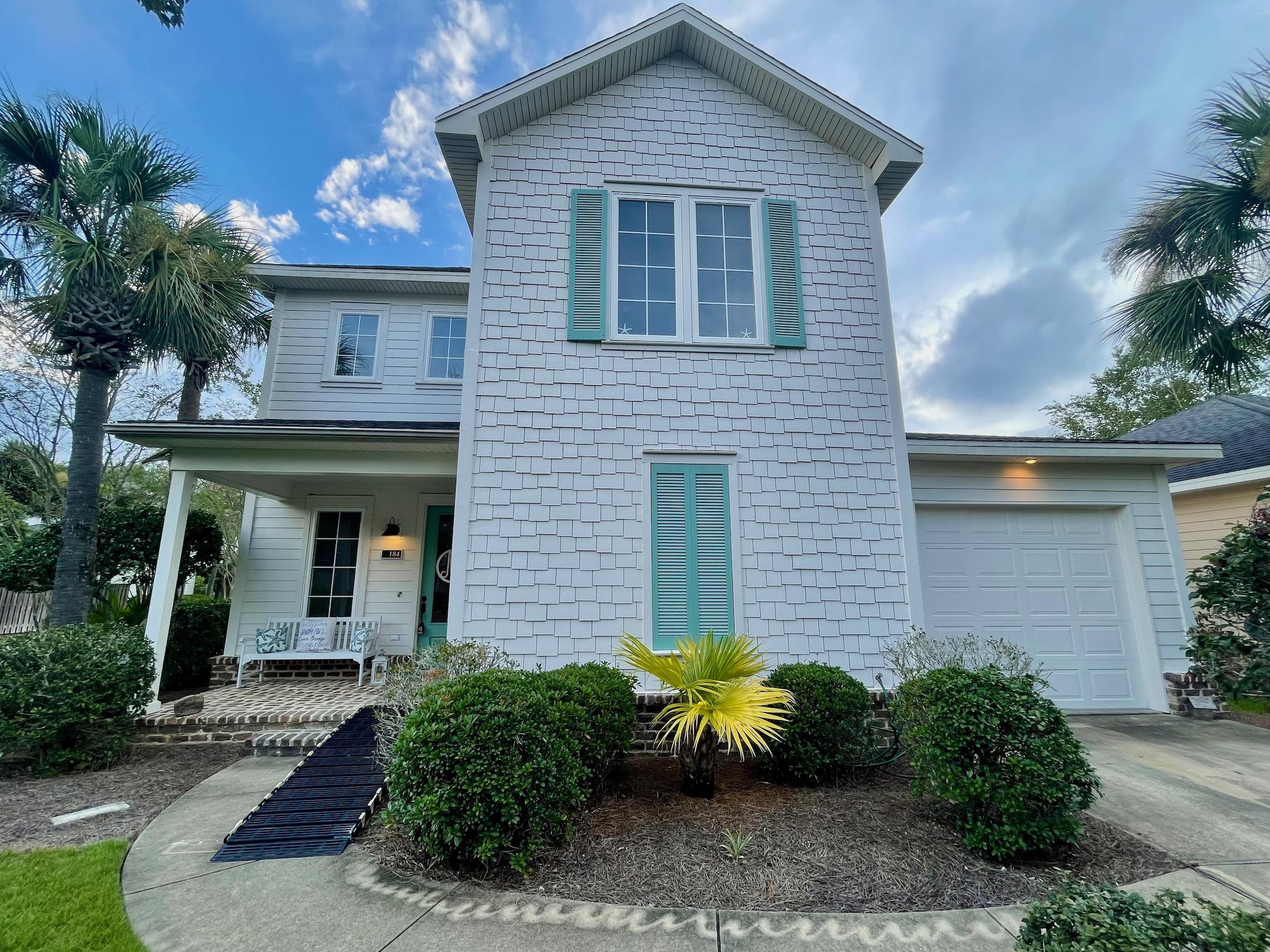 184 South Zander Way Santa Rosa Beach, FL 32459 - Photo 1 of 36 a front view of a house with garden