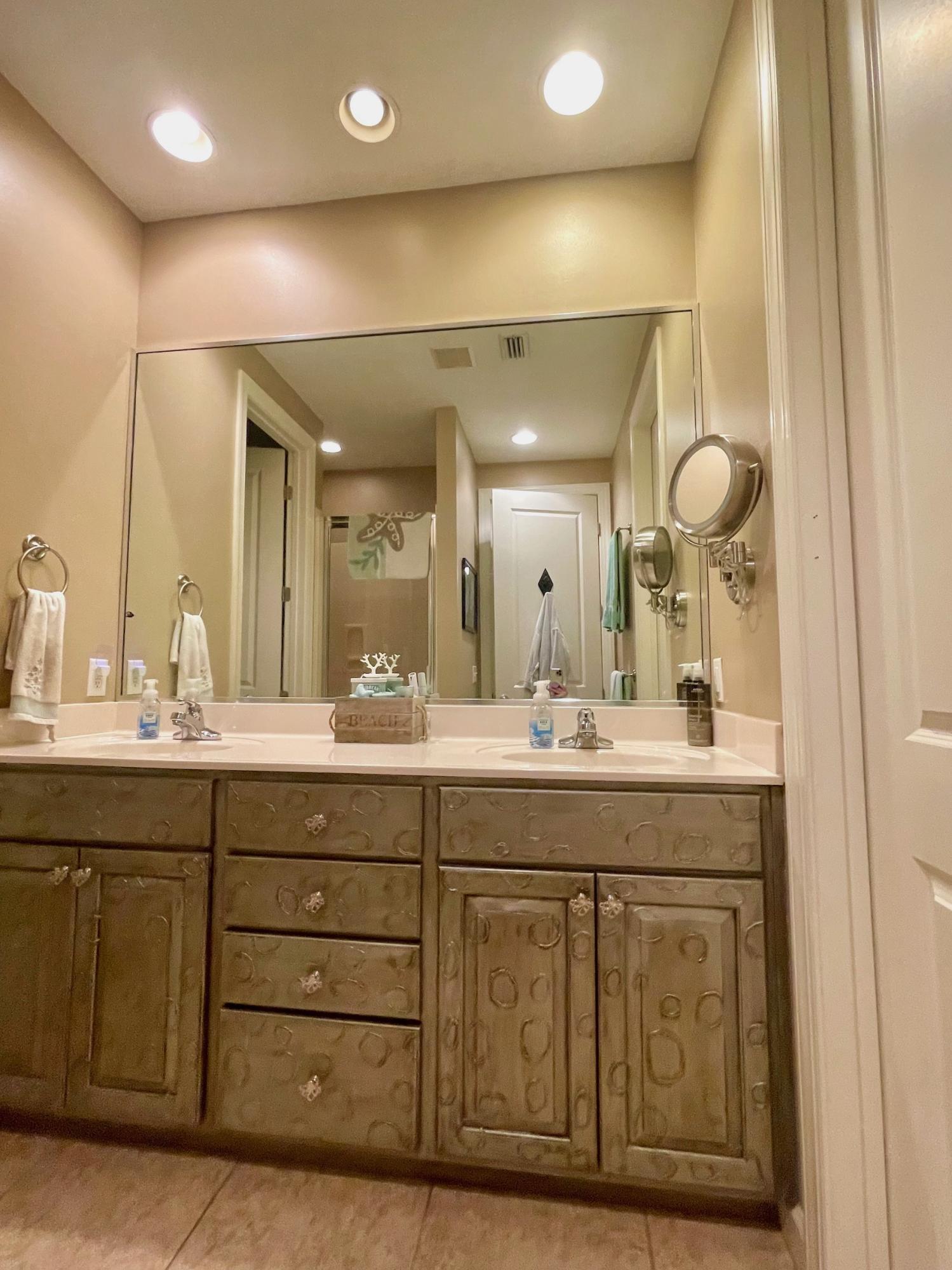 184 South Zander Way Santa Rosa Beach, FL 32459 - Photo 15 of 36 a bathroom with a granite countertop sink a mirror and a