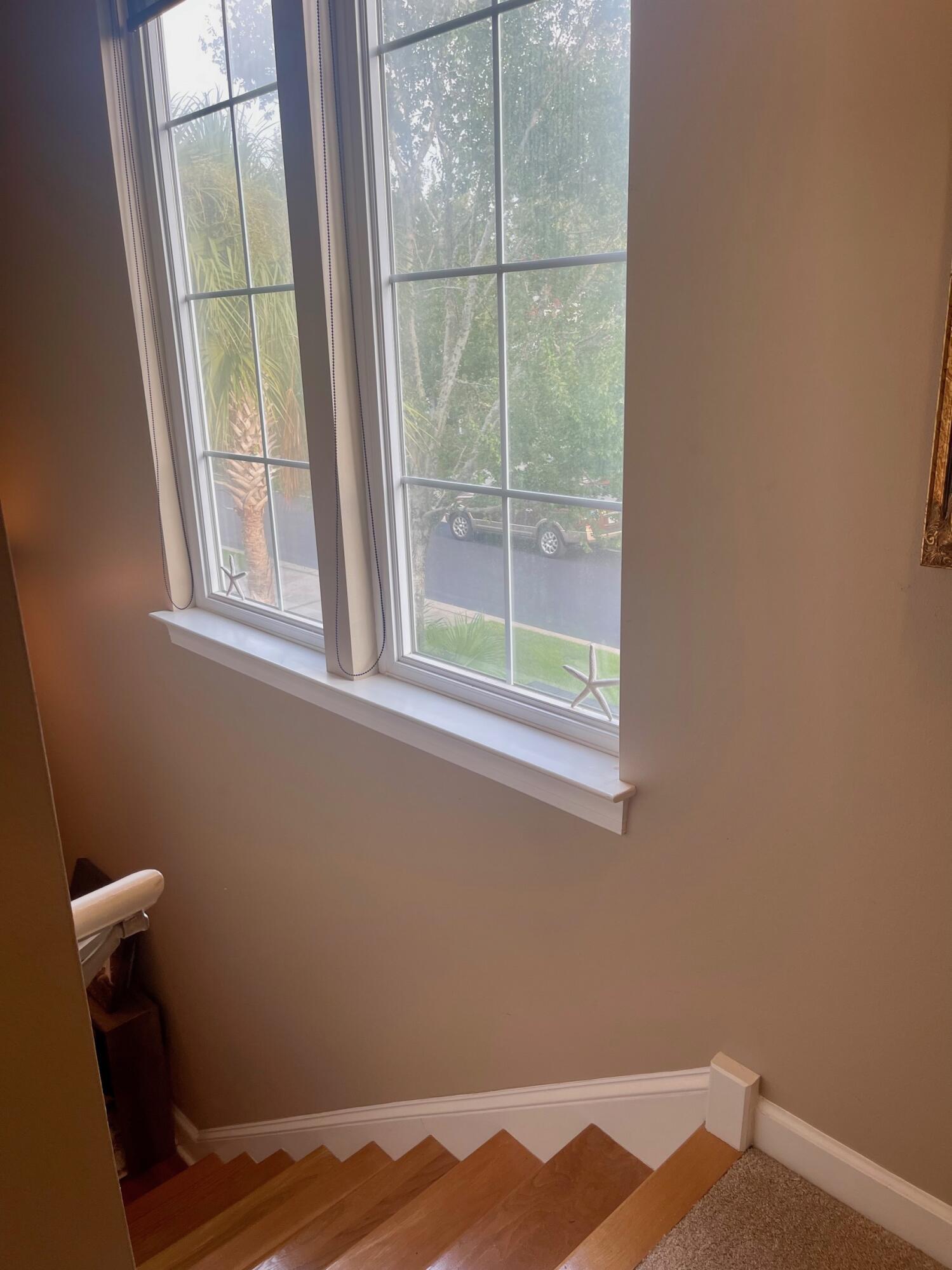 184 South Zander Way Santa Rosa Beach, FL 32459 - Photo 18 of 36 a view of a small space with wooden floor and a window