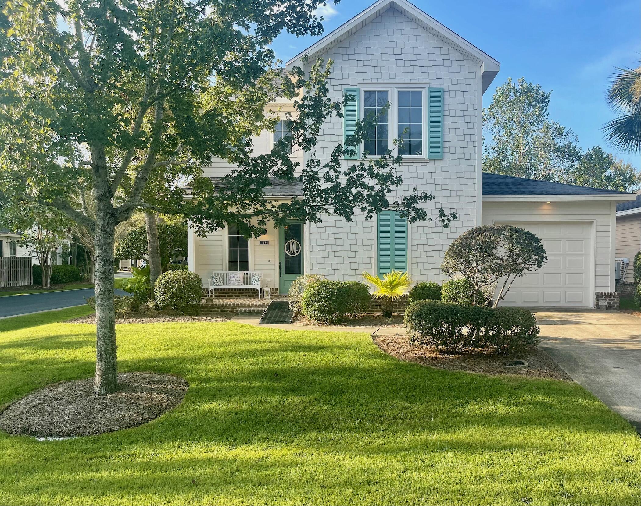 184 South Zander Way Santa Rosa Beach, FL 32459 - Photo 2 of 36 a front view of a house with a yard