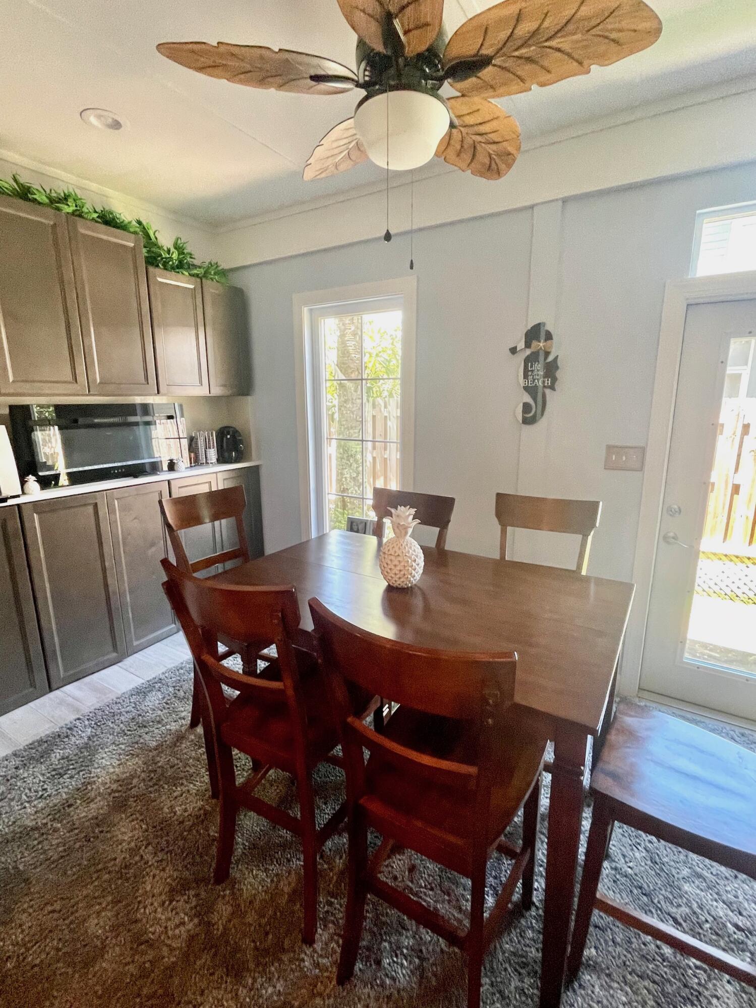 184 South Zander Way Santa Rosa Beach, FL 32459 - Photo 25 of 36 a view of a dining room with furniture