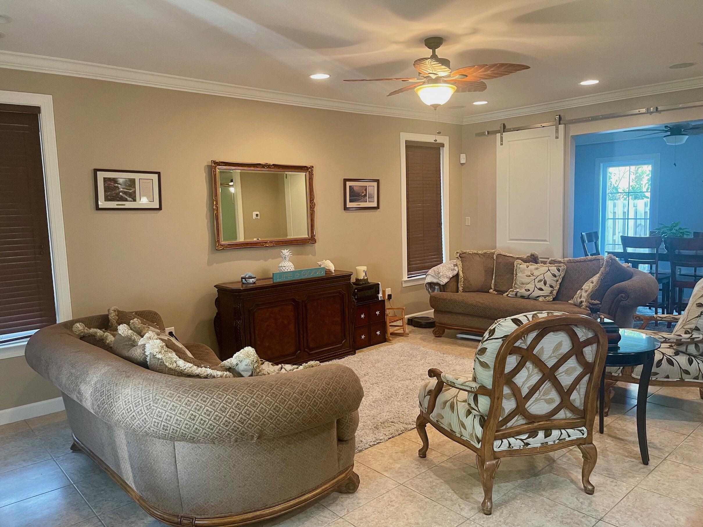 184 South Zander Way Santa Rosa Beach, FL 32459 - Photo 29 of 36 a living room with furniture and a potted plant