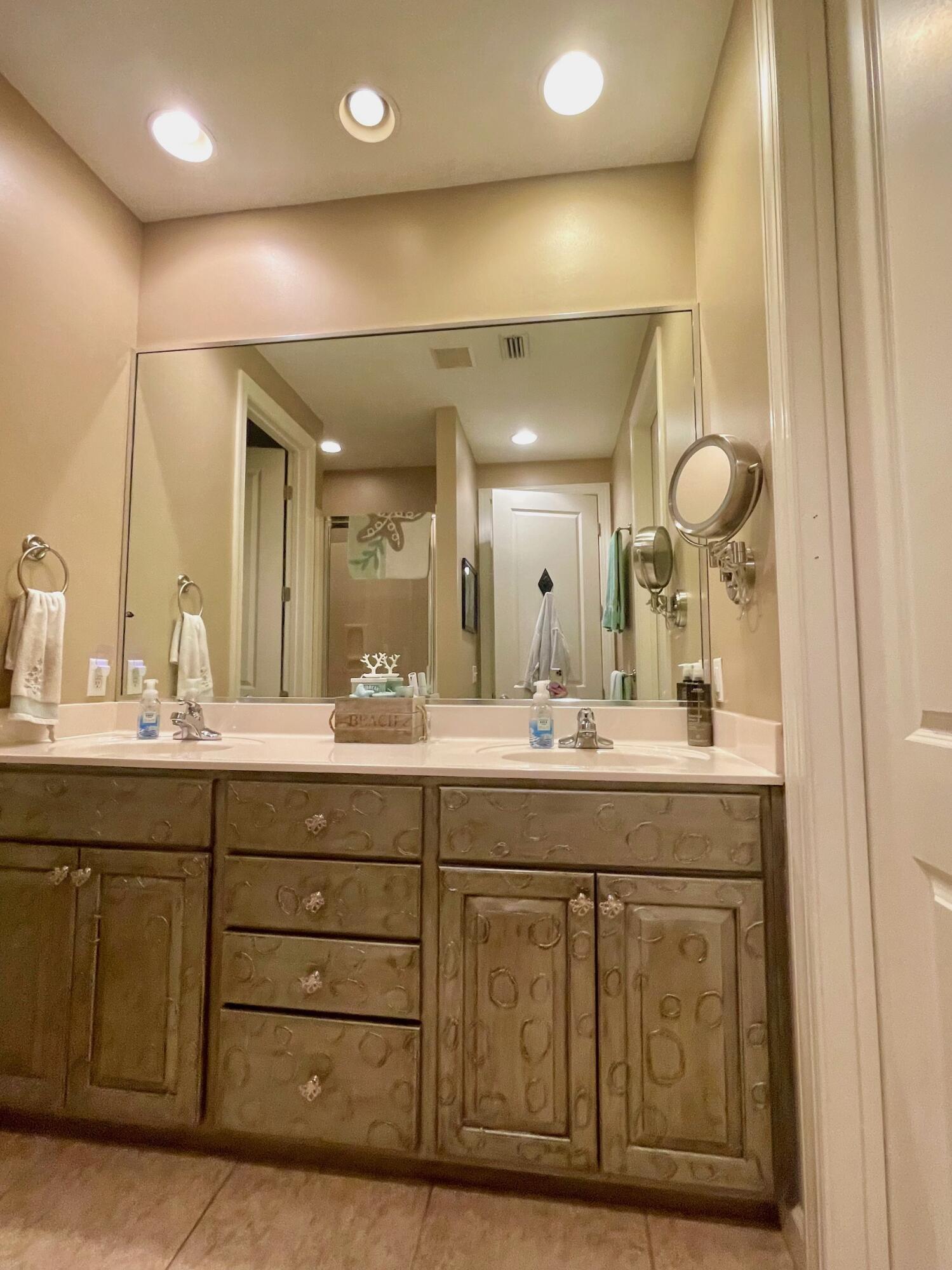 184 South Zander Way Santa Rosa Beach, FL 32459 - Photo 31 of 36 a bathroom with a granite countertop sink a mirror and a