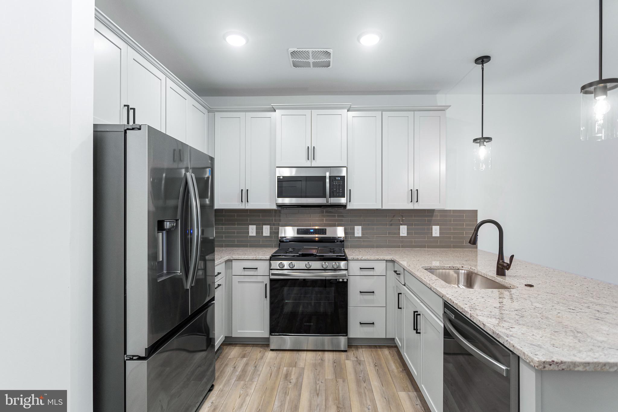 78 Old Mill Bottom Road North, Unit 107 Annapolis, MD 21409 - Photo 19 of 39 a kitchen with a sink stove and refrigerator