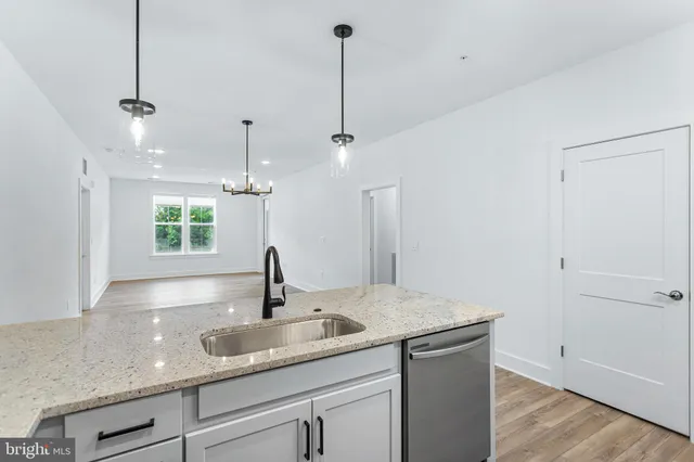 a kitchen with a sink and cabinets