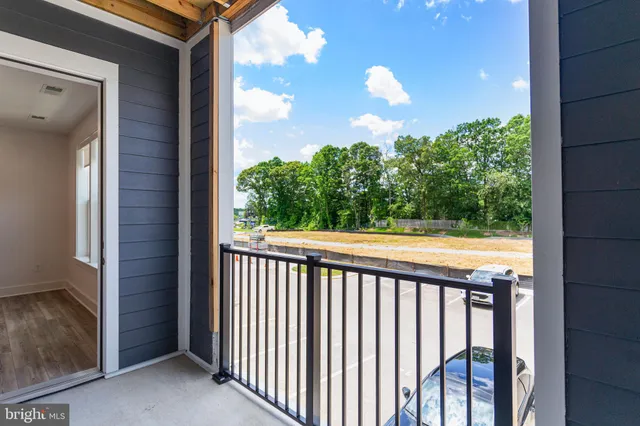 a view of balcony and yard