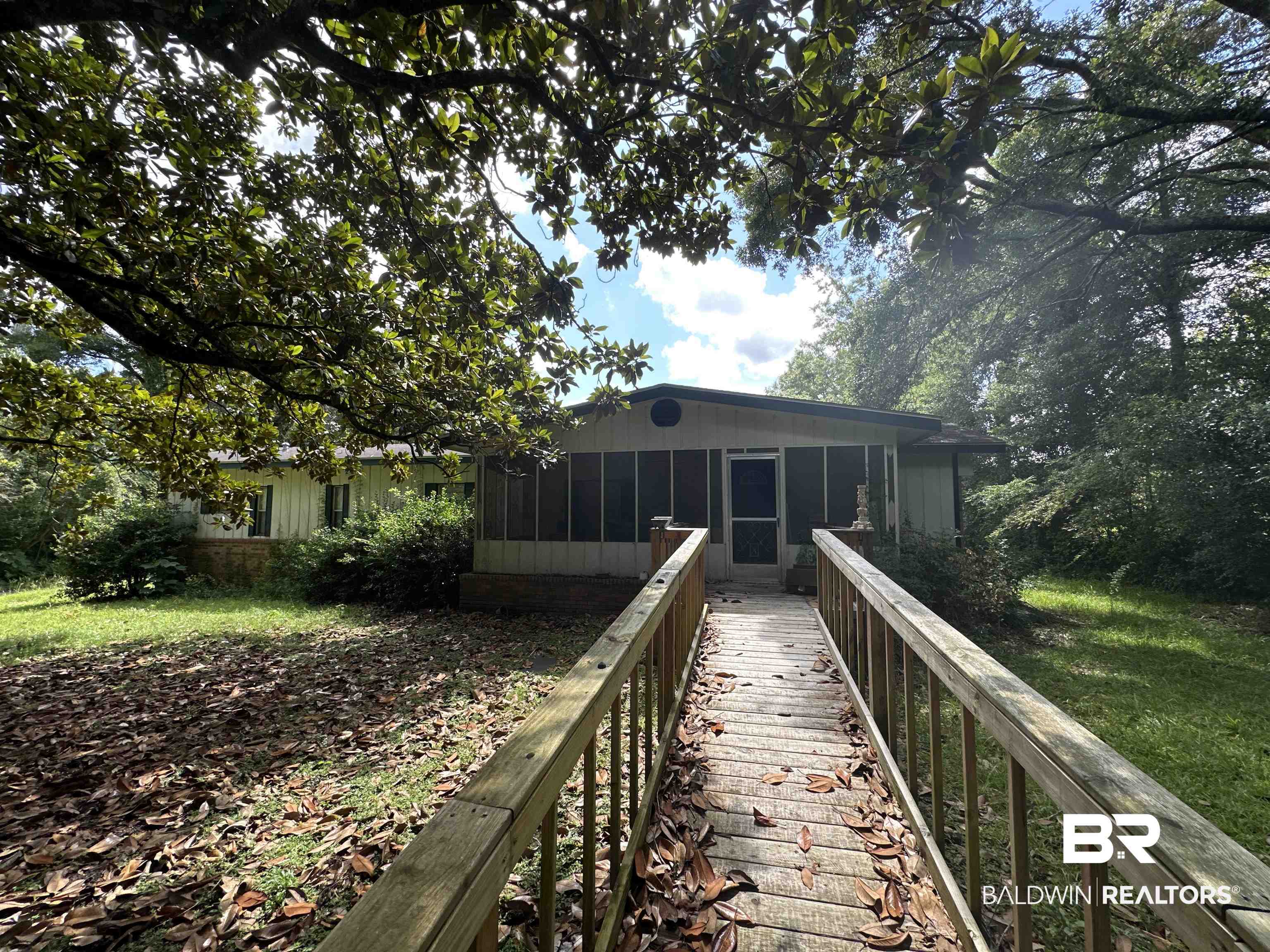 1850 Repoll Drive Mobile, AL 36695 - Photo 1 of 26 Rear view of property featuring a sunroom