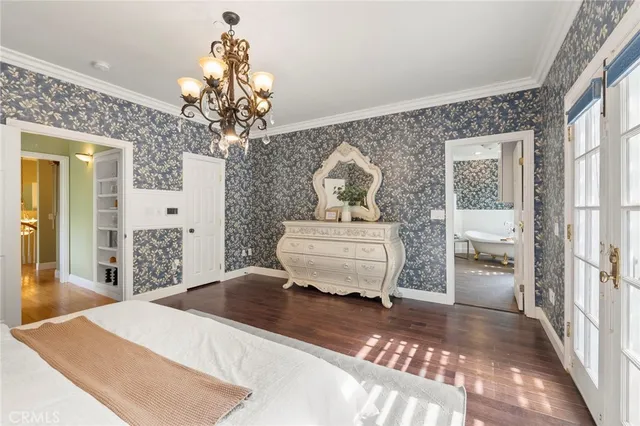 a view of a patio with a table and chairs under an umbrella
