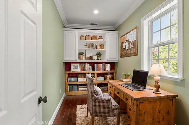 a view of a pathway with a wrought fence