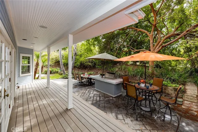 a kitchen with a refrigerator a stove and a wooden floor