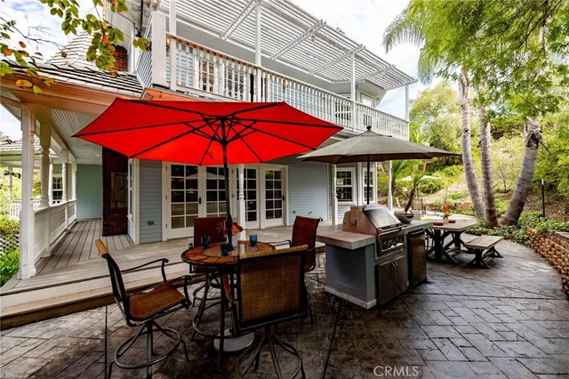a bathroom with a granite countertop sink toilet a mirror and window
