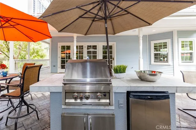 a dining room with furniture a window and wooden floor