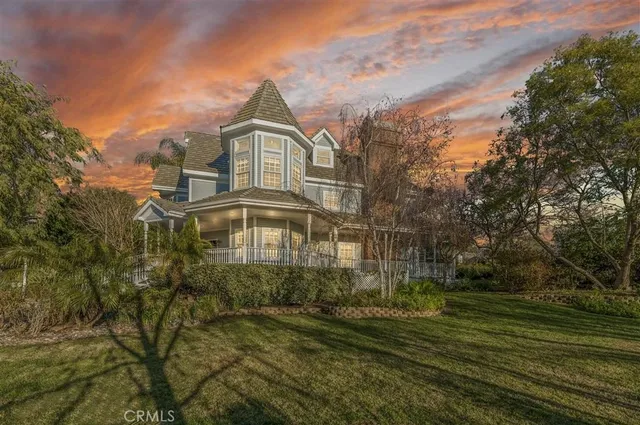 a dining room with furniture and chandelier