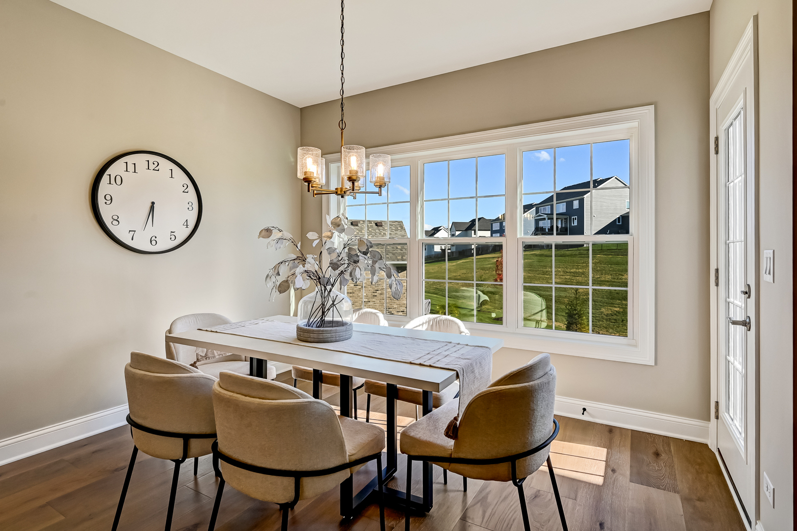 12235 Copper Ridge Drive, Unit 18 Lemont, IL 60439 - Photo 11 of 30 a view of a dining room with furniture window and wooden floor
