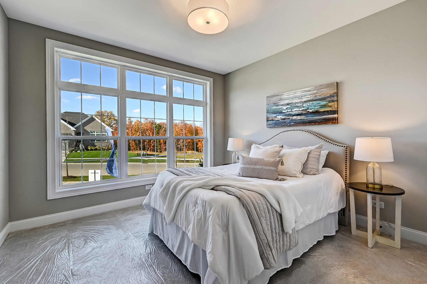 12235 Copper Ridge Drive, Unit 18 Lemont, IL 60439 - Photo 21 of 30 a bedroom with a bed and a large window