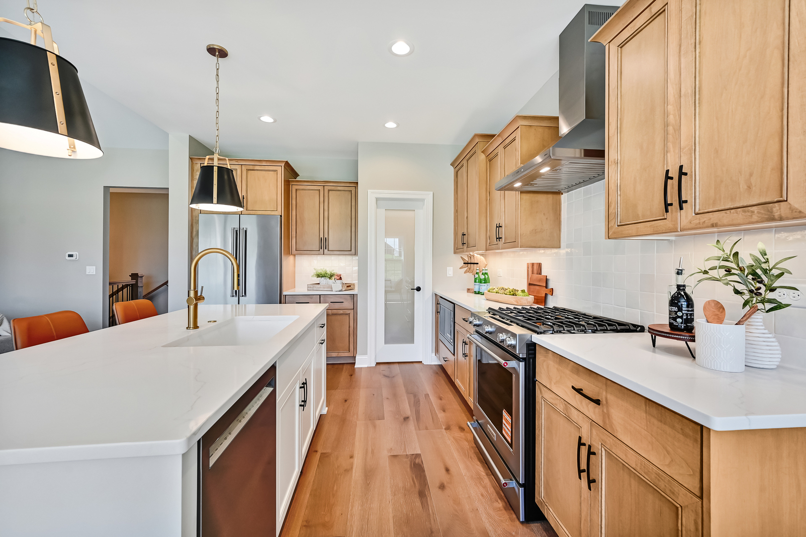 12235 Copper Ridge Drive, Unit 18 Lemont, IL 60439 - Photo 8 of 30 a open kitchen with stainless steel appliances granite countertop a sink stove and refrigerator