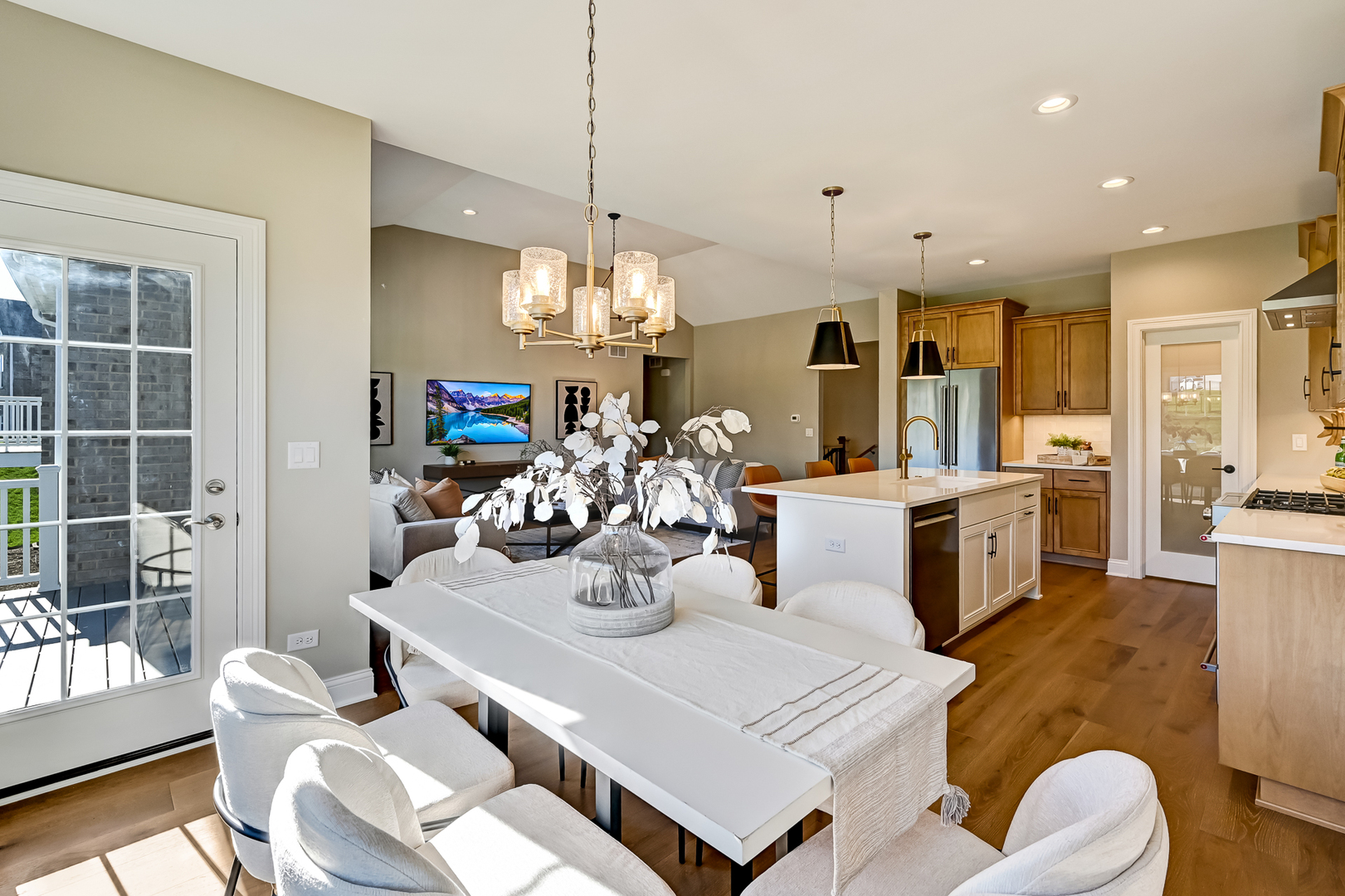 12235 Copper Ridge Drive, Unit 18 Lemont, IL 60439 - Photo 10 of 30 a view of a dining room and livingroom with furniture wooden floor a chandelier