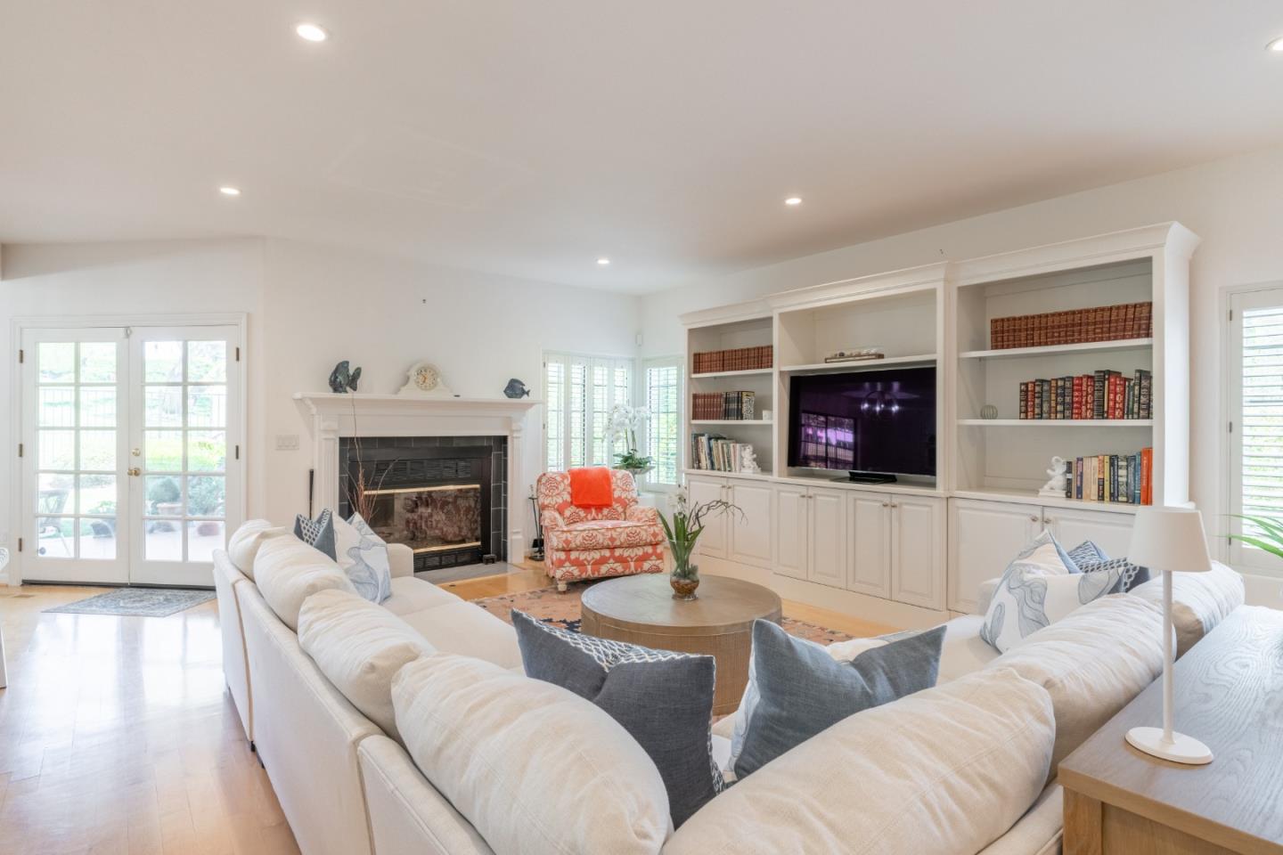 1043 Broncho Road Pebble Beach, CA 93953 - Photo 8 of 21 a living room with furniture a flat screen tv and a fireplace