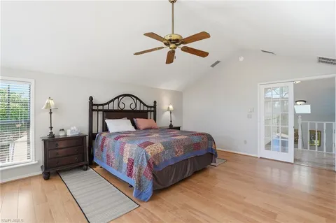 a bedroom with a large bed and a dresser