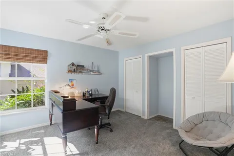 a bathroom with a sink a toilet a mirror and shower