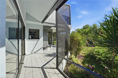a view of balcony with wooden floor