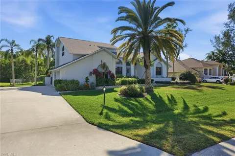a view of multiple houses with a yard
