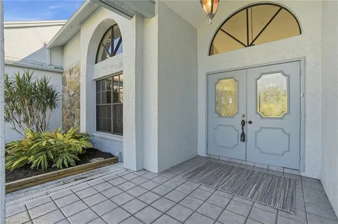 an entryway view with a garden space