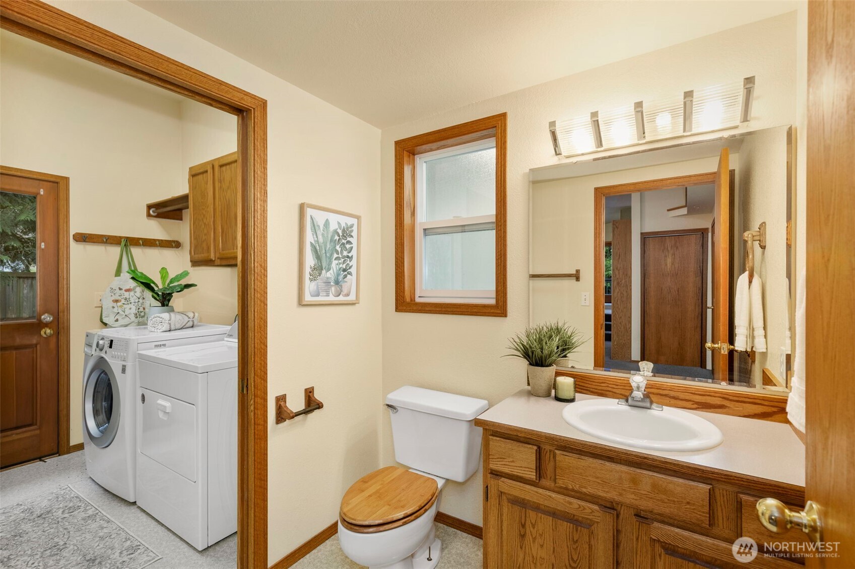 26388 Ansell Road Northwest Poulsbo, WA 98370 - Photo 15 of 37 a bathroom with a granite countertop sink vanity mirror and toilet