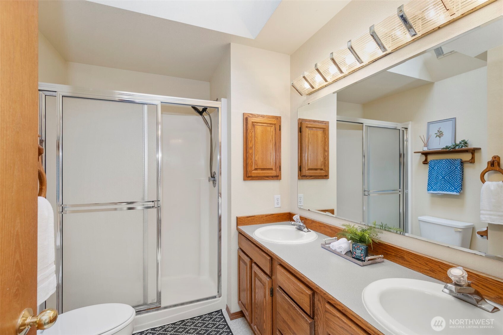 26388 Ansell Road Northwest Poulsbo, WA 98370 - Photo 19 of 37 a bathroom with a granite countertop sink toilet and shower