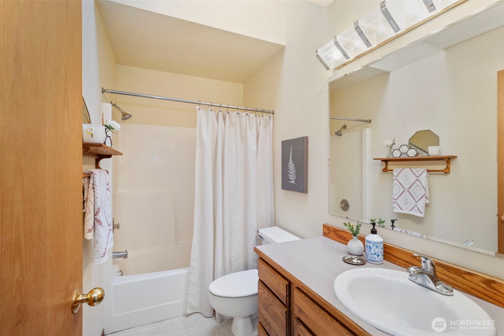 26388 Ansell Road Northwest Poulsbo, WA 98370 - Photo 23 of 37 a bathroom with a sink toilet tub and shower
