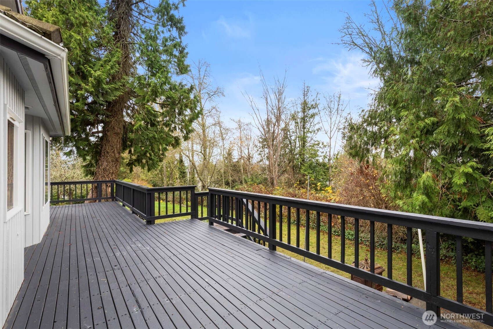 26388 Ansell Road Northwest Poulsbo, WA 98370 - Photo 30 of 37 a view of balcony with furniture and wooden deck