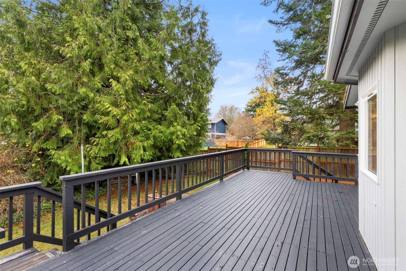 26388 Ansell Road Northwest Poulsbo, WA 98370 - Photo 31 of 37 a view of balcony with wooden floor and fence
