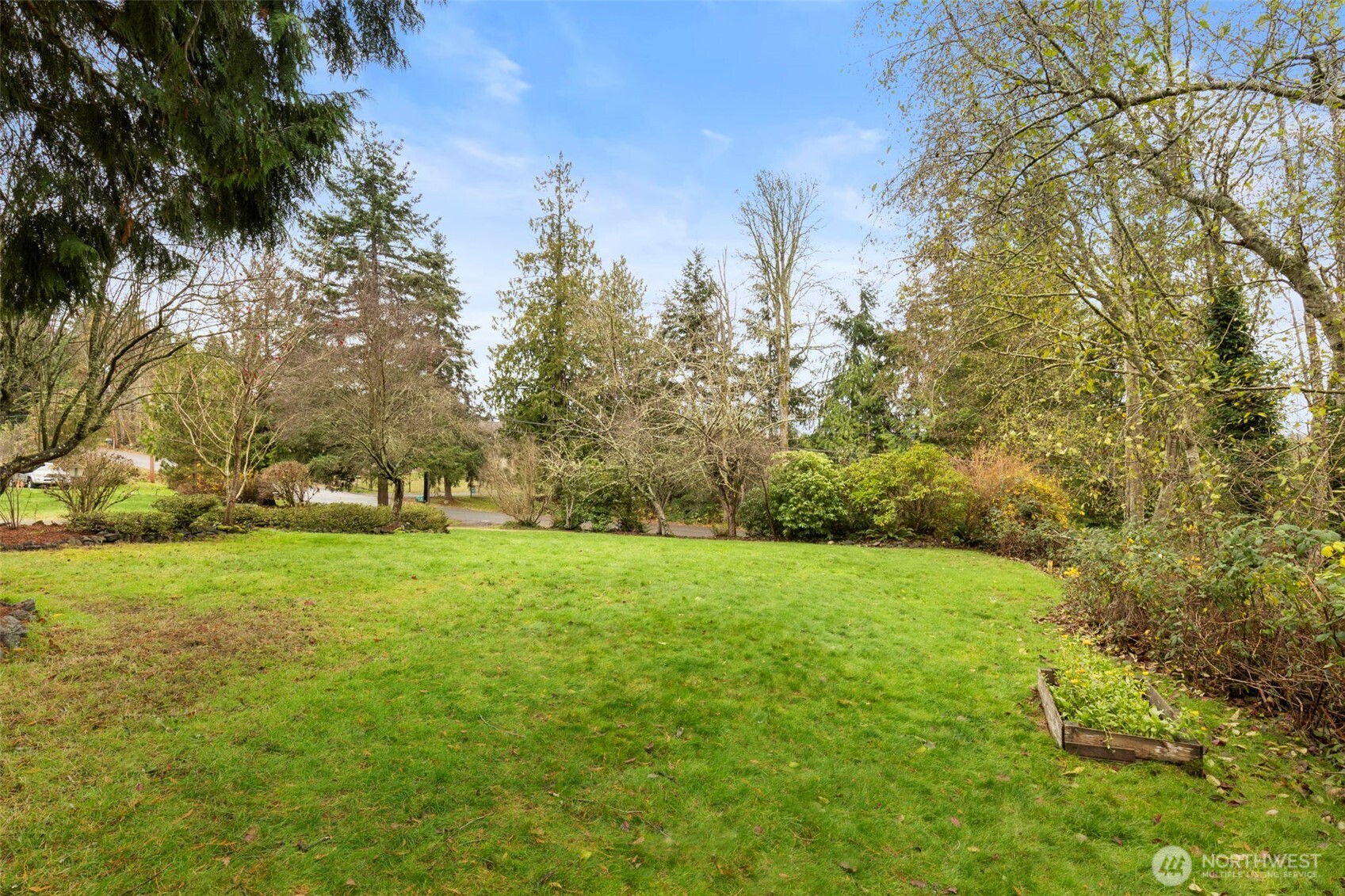 26388 Ansell Road Northwest Poulsbo, WA 98370 - Photo 33 of 37 a view of field with trees in the background