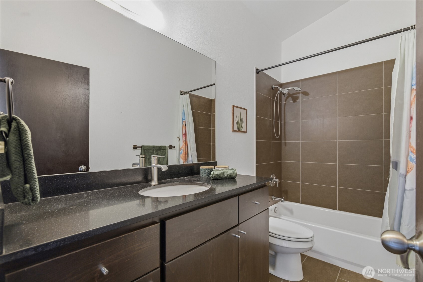 8408 Delridge Way Southwest, Unit A Seattle, WA 98106 - Photo 11 of 22 a bathroom with a sink a toilet a mirror and shower