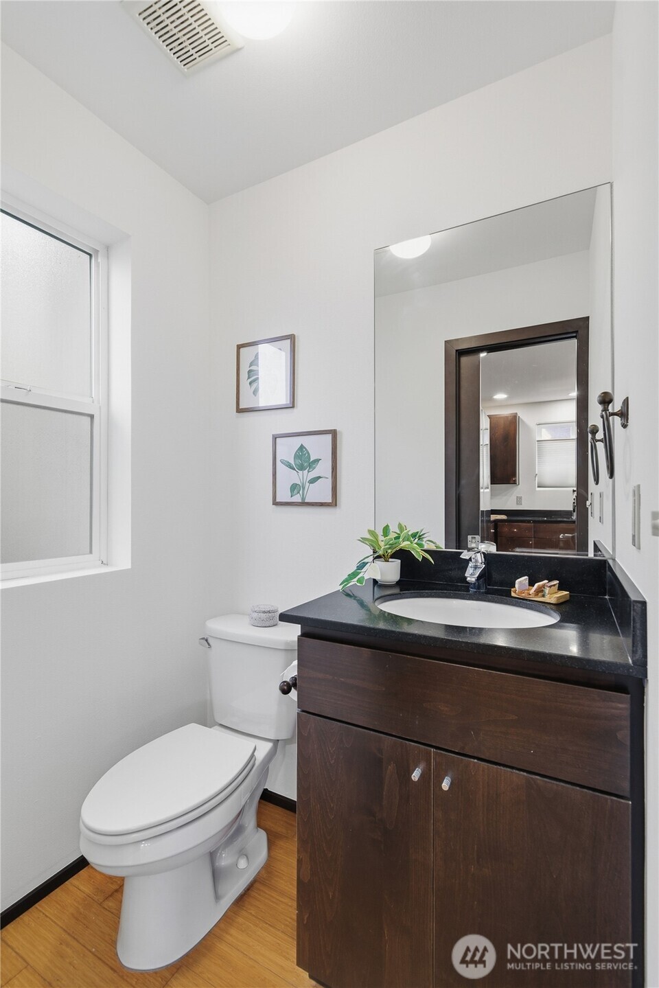 8408 Delridge Way Southwest, Unit A Seattle, WA 98106 - Photo 12 of 22 a bathroom with a toilet sink and mirror