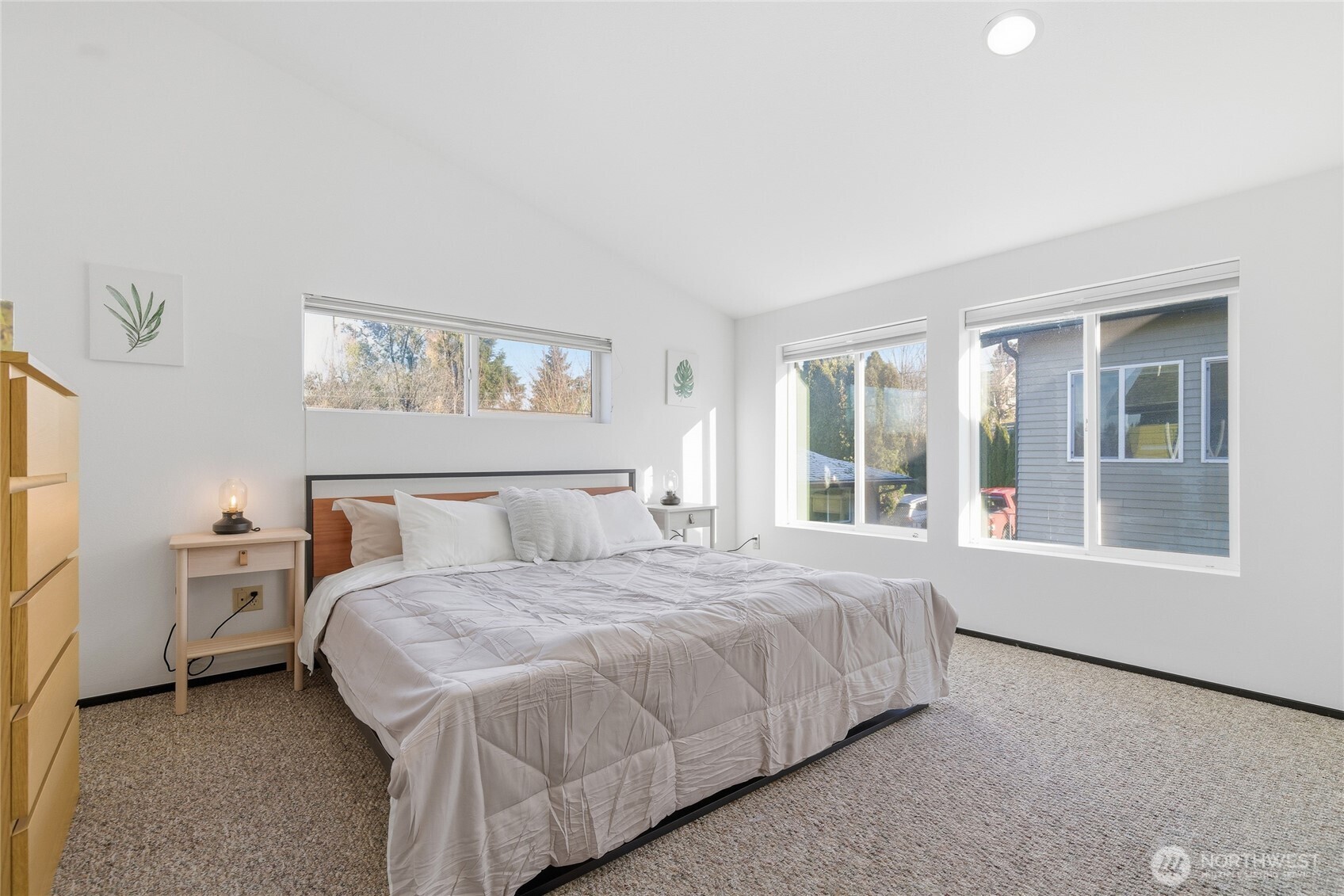 8408 Delridge Way Southwest, Unit A Seattle, WA 98106 - Photo 13 of 22 a bedroom with a bed and a large window