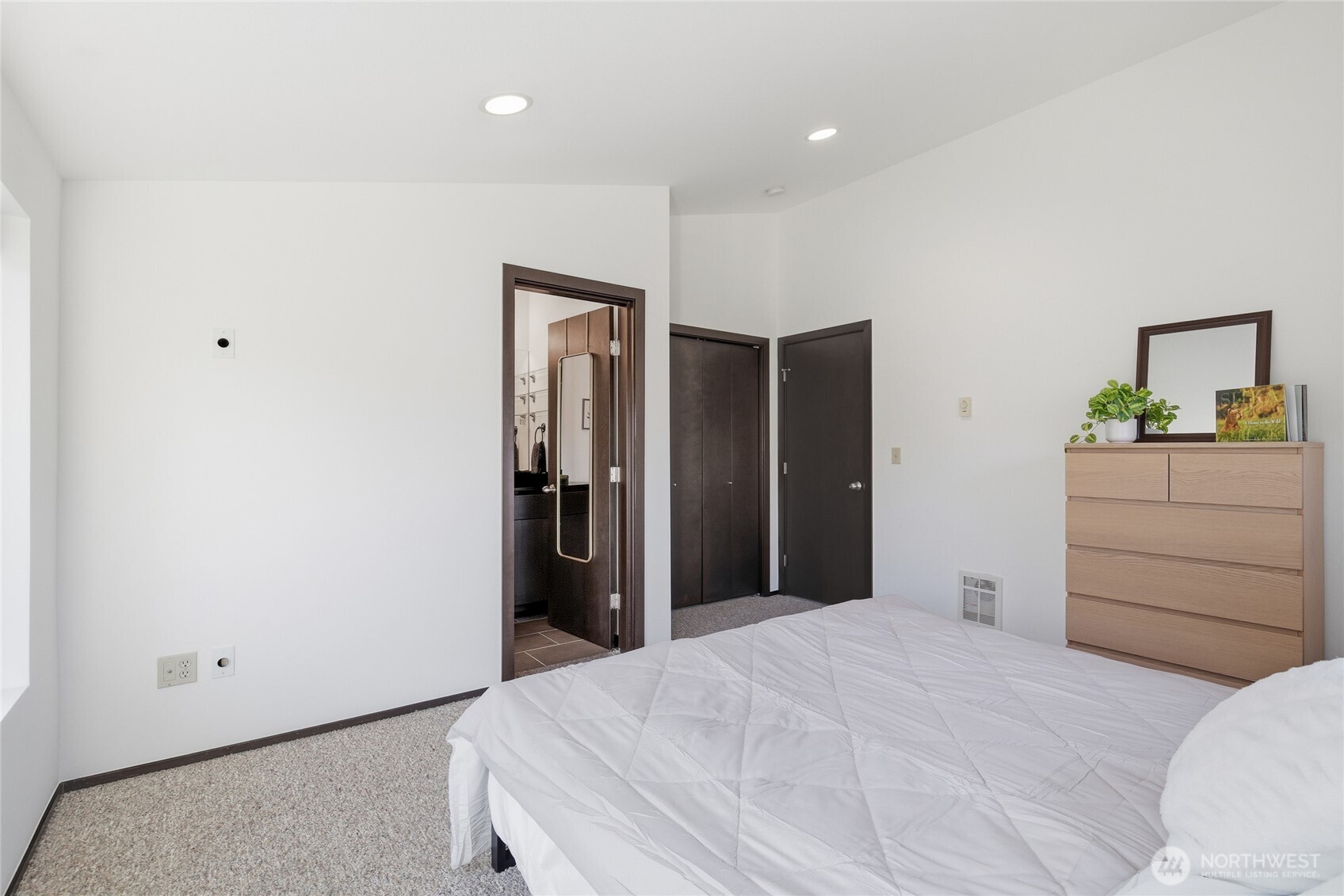8408 Delridge Way Southwest, Unit A Seattle, WA 98106 - Photo 15 of 22 a bedroom with a bed and a dresser