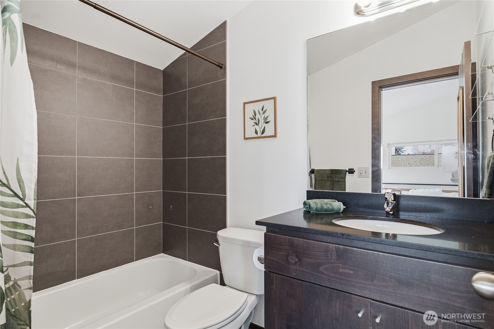 8408 Delridge Way Southwest, Unit A Seattle, WA 98106 - Photo 10 of 22 a bathroom with a toilet a sink and mirror