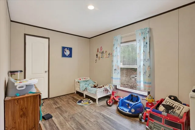 a room with furniture and a wooden floor