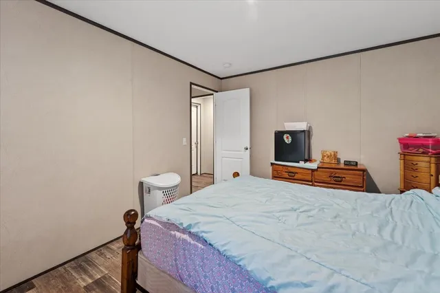 a bedroom with a bed and a table in it