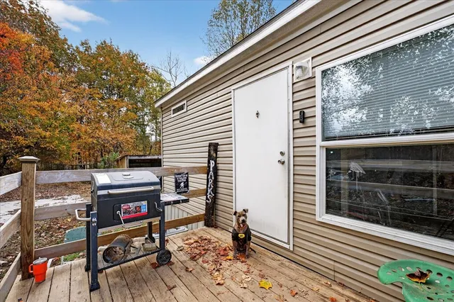 a backyard of a house with outdoor seating