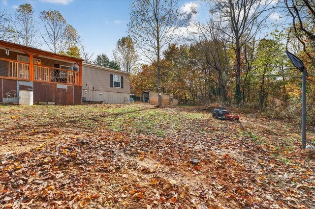 a sign that is sitting on a wooden bench