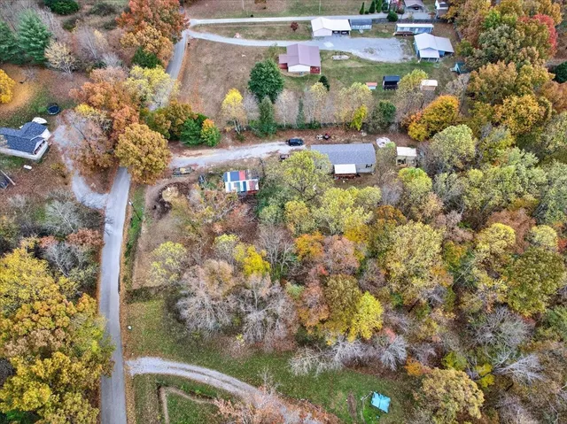 an aerial view of residential building with green space