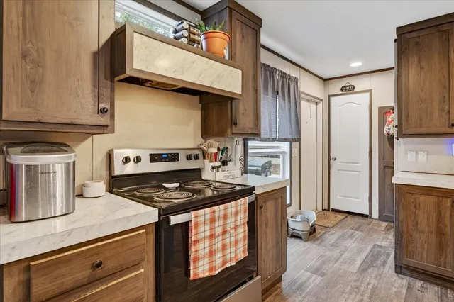 a large kitchen with a table and chairs