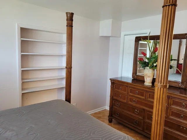 a bathroom with a shower and a sink