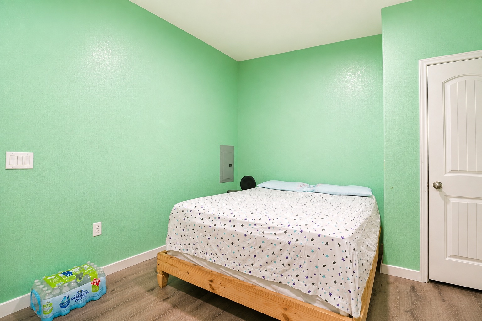 130 Los Arcos Road Elgin, TX 78621 - Photo 25 of 39 A well-lit bedroom provides comfortable accommodations with ample space.