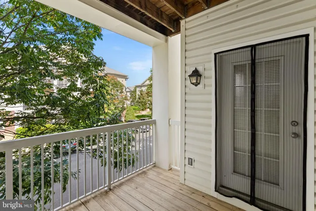 a view of a balcony with wooden floor
