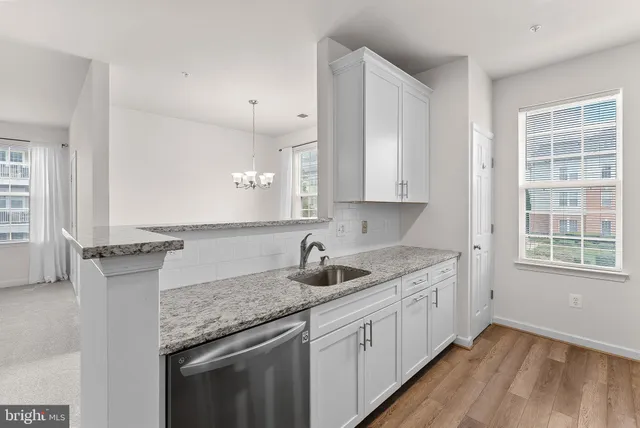 a kitchen that has a sink and a stove