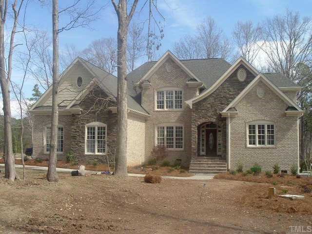 9814 Macon Road Raleigh, NC 27613 - Photo 1 of 1 a front view of a house with a yard and garage