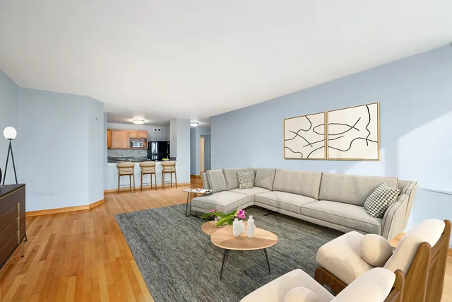 a view of a swimming pool with a table and chairs under an umbrella